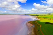 Insane drone photos of pink lakes, erupting volcanoes, and more